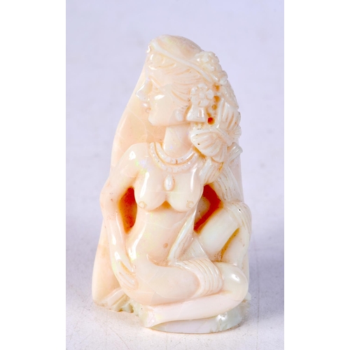 3590 - A carved Opal boulder in the form of a female.6 cm .