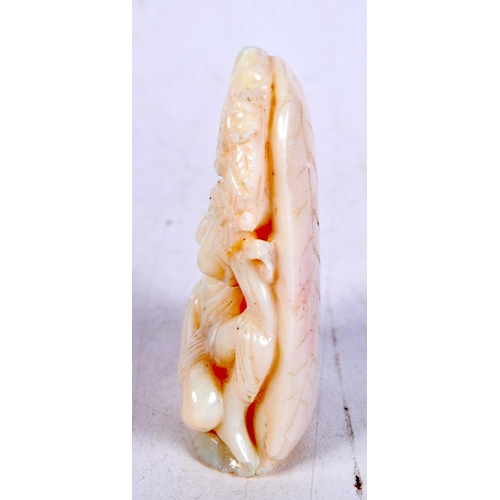 3590 - A carved Opal boulder in the form of a female.6 cm .