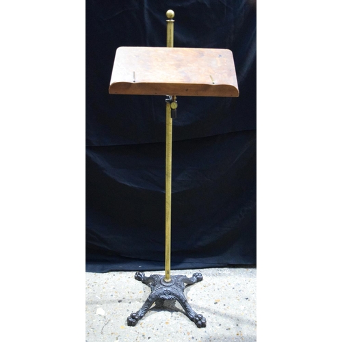 3997 - An antique  brass and wood music stand 123 cm.