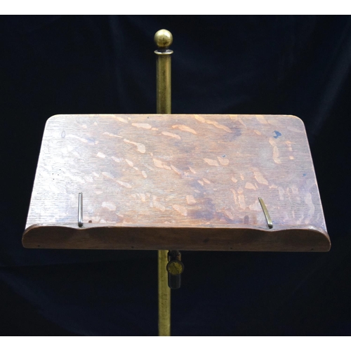 3997 - An antique  brass and wood music stand 123 cm.