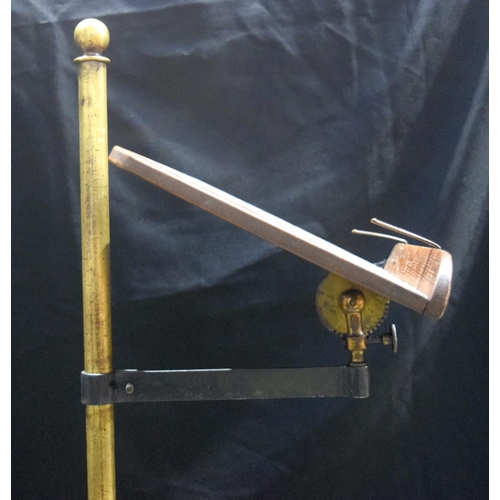 3997 - An antique  brass and wood music stand 123 cm.