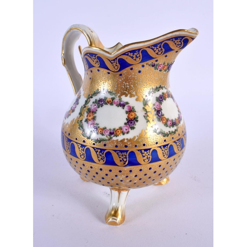 186 - Late 18th c. Sevres three footed milk jug enamelled and gilt with floral wreaths within cobalt blu... 