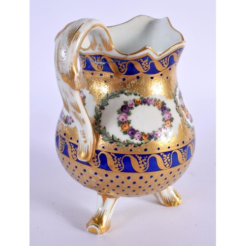 186 - Late 18th c. Sevres three footed milk jug enamelled and gilt with floral wreaths within cobalt blu... 