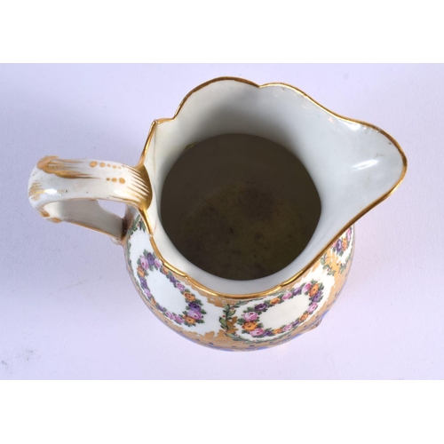 186 - Late 18th c. Sevres three footed milk jug enamelled and gilt with floral wreaths within cobalt blu... 