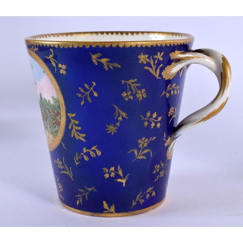 187 - Sevres trembleuse cup and saucer painted with three panels of figures on a cobalt blue and gilt grou... 