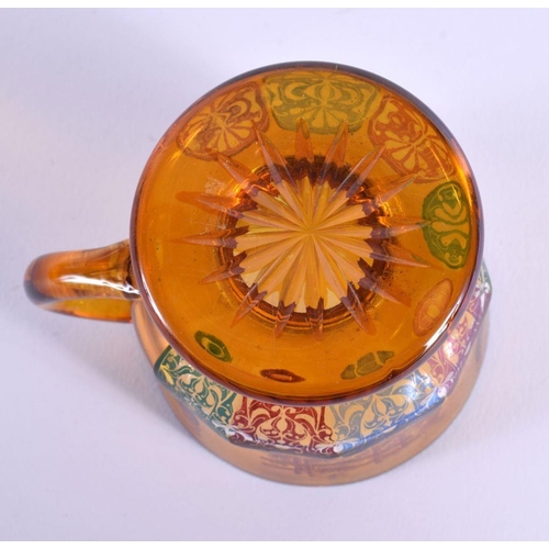19 - AN UNUSUAL 19TH CENTURY BOHEMIAN AMBER GLASS CUP painted with fowl and motifs. 10 cm x 8 cm.