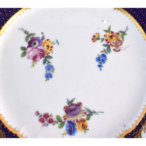 196 - Sevres plate, the centre painted with three floral sprays, the blue-de-roi border with three gilt fl... 