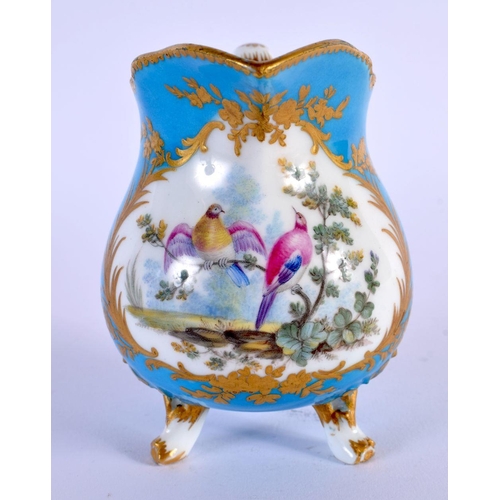 201 - Sevres blue celeste three footed milk jug painted with birds in the style of Oncle, interlaced Ls i... 