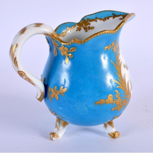 201 - Sevres blue celeste three footed milk jug painted with birds in the style of Oncle, interlaced Ls i... 