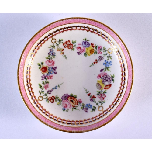 202 - Sevres coffee cup and saucer painted with festoons of flowers hanging from gilt rings under a pink b... 