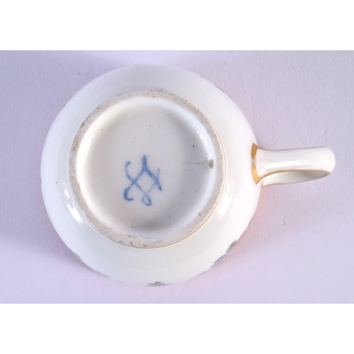 202 - Sevres coffee cup and saucer painted with festoons of flowers hanging from gilt rings under a pink b... 