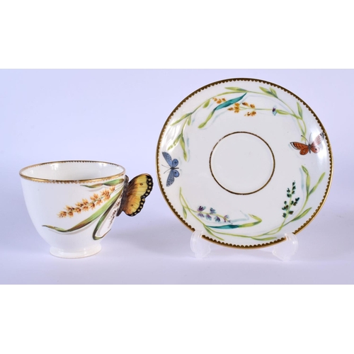 219 - 19th c. English porcelain butterfly handled coffee cup and moulded saucer painted with wild flowers ... 