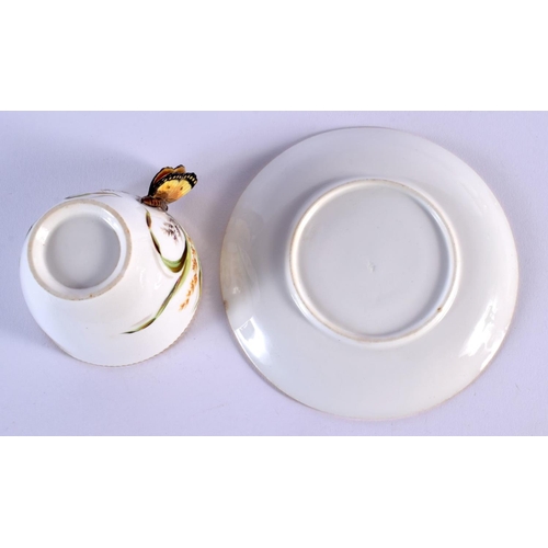 219 - 19th c. English porcelain butterfly handled coffee cup and moulded saucer painted with wild flowers ... 