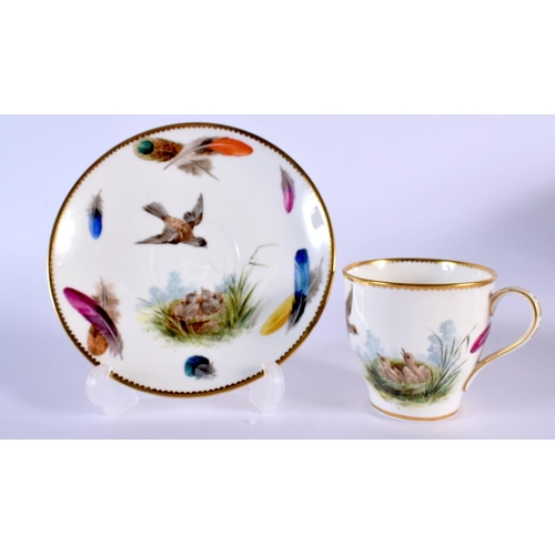 221 - Minton's coffee cup and saucer, painted with a bird in flight above its nesting young, the border wi... 