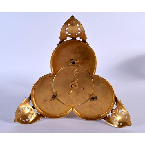 225 - Three continental biscuit figures on a gilt metal stand. 18Cm high.