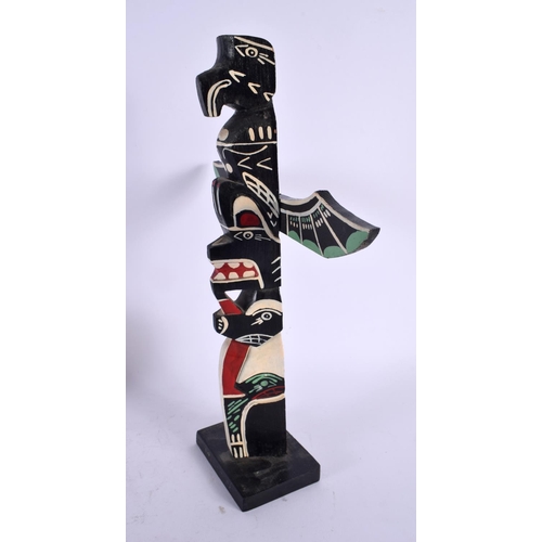 404 - A VINTAGE NORTH AMERICAN CANADIAN PAINTED WOOD TOTEM POLE. 33 cm x 18 cm.