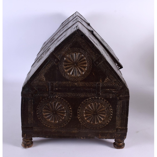 405 - A 19TH CENTURY WESTERN INDIAN CARVED WOOD DOWRY BOX with pitched top and hinged lid, decorated with ... 