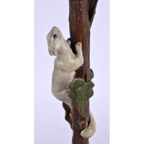 409 - A PAIR OF CONTINENTAL COLD PAINTED BRONZE CANDLESTICKS formed with squirrels climbing on a tree. 29 ... 