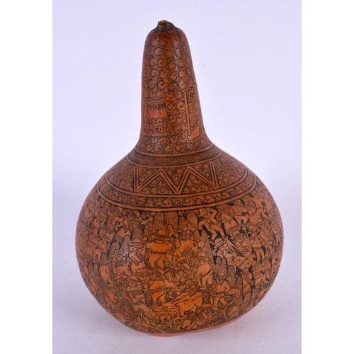 410 - AN ANTIQUE CONTINENTAL CARVED AND ENGRAVED GOURD NUT. 14 cm x 7 cm.