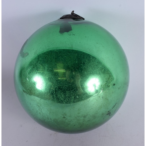 412 - AN ANTIQUE GLASS WITCHES BALL. 13.5 cm wide.