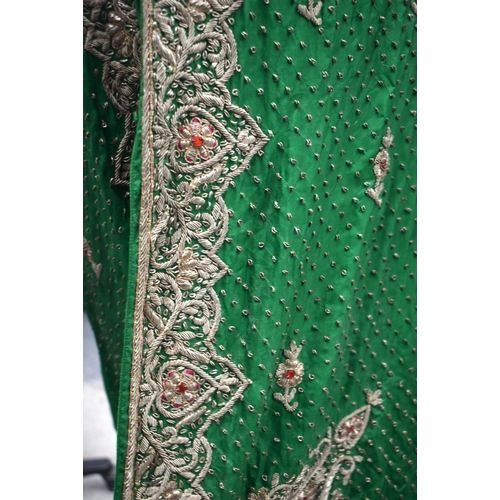 418 - AN INDIAN SILVER THREAD GREEN SILK PEACOCK ROBE. 110 cm x 115 cm.