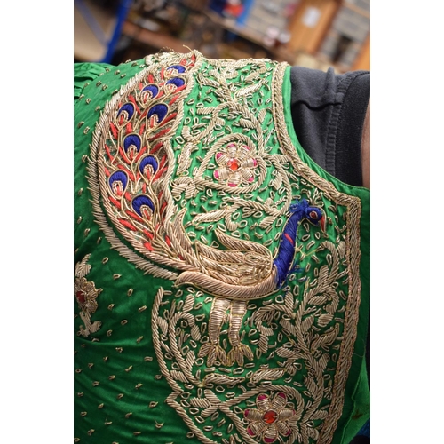 418 - AN INDIAN SILVER THREAD GREEN SILK PEACOCK ROBE. 110 cm x 115 cm.