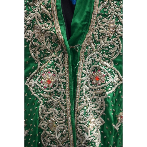 418 - AN INDIAN SILVER THREAD GREEN SILK PEACOCK ROBE. 110 cm x 115 cm.