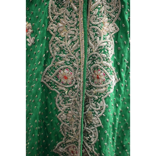 418 - AN INDIAN SILVER THREAD GREEN SILK PEACOCK ROBE. 110 cm x 115 cm.