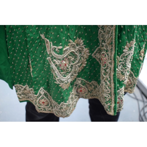 418 - AN INDIAN SILVER THREAD GREEN SILK PEACOCK ROBE. 110 cm x 115 cm.