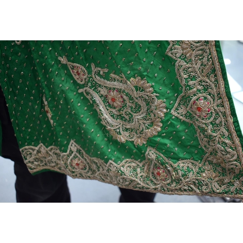 418 - AN INDIAN SILVER THREAD GREEN SILK PEACOCK ROBE. 110 cm x 115 cm.