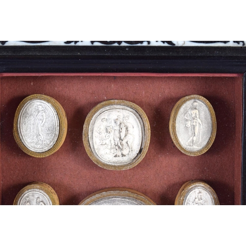 419 - A 19TH CENTURY FRAMED SET OF COUNTRY HOUSE PLASTER INTAGLIOS contained within an Italian ebonised fr... 