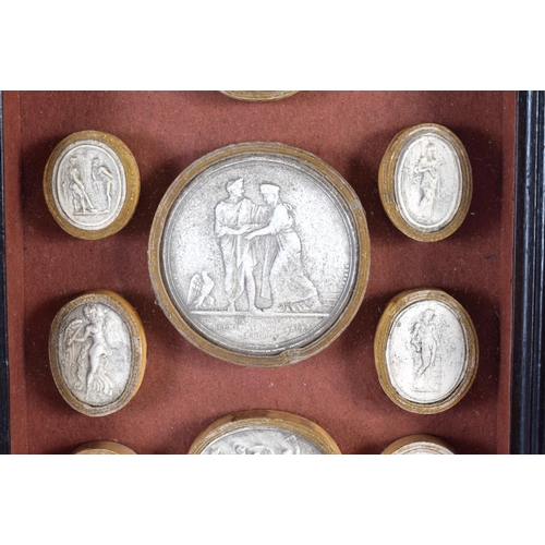 419 - A 19TH CENTURY FRAMED SET OF COUNTRY HOUSE PLASTER INTAGLIOS contained within an Italian ebonised fr... 