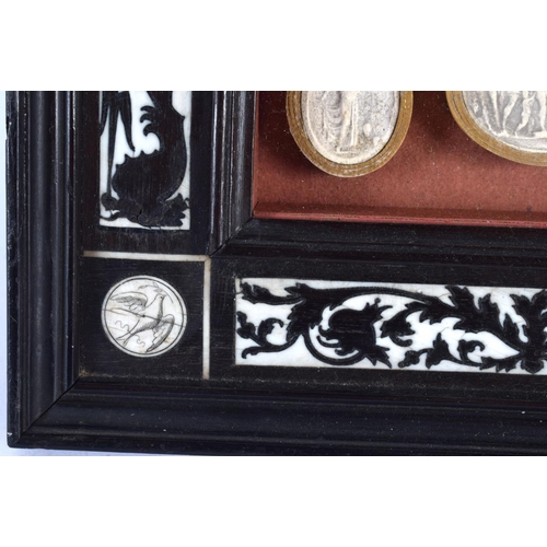 419 - A 19TH CENTURY FRAMED SET OF COUNTRY HOUSE PLASTER INTAGLIOS contained within an Italian ebonised fr... 