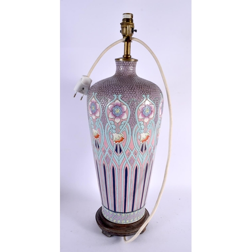 422 - AN ART NOUVEAU ENAMELLED PORCELAIN LAMP painted with flowers. 48 cm x 18 cm.