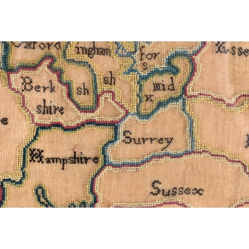 435 - AN 18TH CENTURY FRAMED SAMPLER MAP OF ENGLAND AND WALES by Ann Ambler 1785. 60 cm x 54 cm.