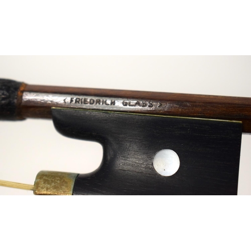 446 - A GERMAN VIOLIN BOW by Friedrich Glass. 74 cm long.