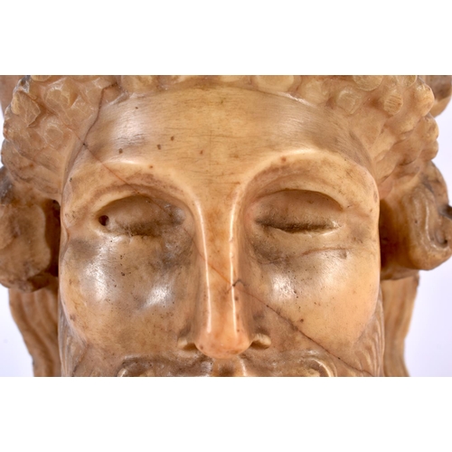 455 - AN EARLY GREEK CARVED STONE MARBLE HEAD OF A GOD modelled as a bearded male. 21 cm x 12 cm.