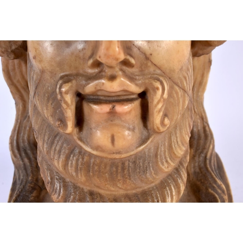 455 - AN EARLY GREEK CARVED STONE MARBLE HEAD OF A GOD modelled as a bearded male. 21 cm x 12 cm.