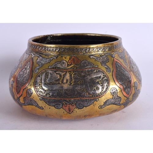 458 - A 19TH CENTURY MIDDLE EASTERN ISLAMIC SILVER INLAID CENSER decorated with calligraphy. 15 cm wide.