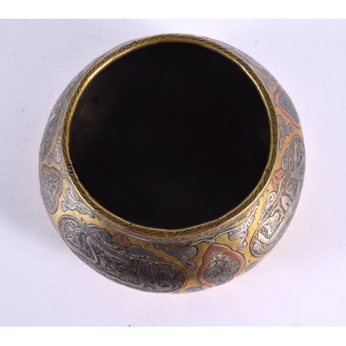 458 - A 19TH CENTURY MIDDLE EASTERN ISLAMIC SILVER INLAID CENSER decorated with calligraphy. 15 cm wide.