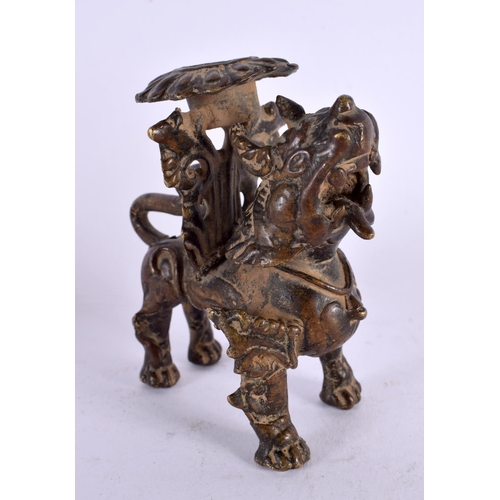 459 - A 17TH/18TH CENTURY SOUTH EAST ASIAN BRONZE CANDLESTICK formed as a scowling beast. 9 cm x 6 cm.