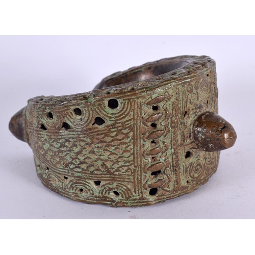 461 - A LARGE 18TH/19TH CENTURY MIDDLE EASTERN BRONZE CUFF BANGLE. 13 cm x 13 cm.