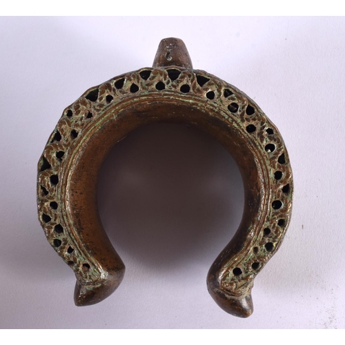 461 - A LARGE 18TH/19TH CENTURY MIDDLE EASTERN BRONZE CUFF BANGLE. 13 cm x 13 cm.