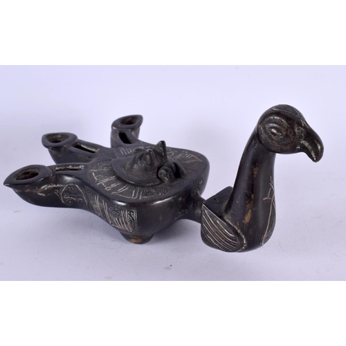 462 - A 19TH CENTURY MIDDLE EASTERN SILVER INLAID BRONZE OIL LAMP formed as a bird, decorated with motifs.... 