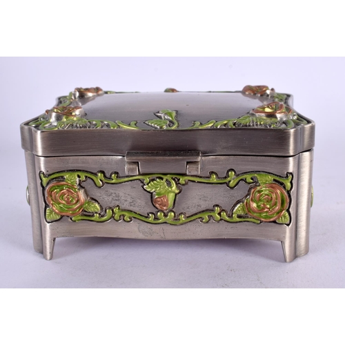 465 - AN UNUSUAL ENAMELLED WHITE METAL JEWELLERY BOX overlaid with foliage and vines. 381 grams. 10 cm x 7... 