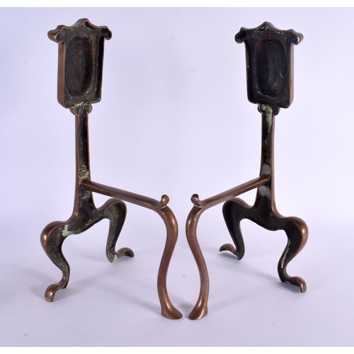 470 - A LOVELY PAIR OF ARTS AND CRAFTS STYLISED ANDIRONS formed with shield panels upon organic scrolling ... 