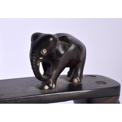 489 - A LATE 19TH CENTURY ANGLO INDIAN CARVED HARDWOOD ELEPHANT GROUP modelled roaming. 45 cm x 20 cm.