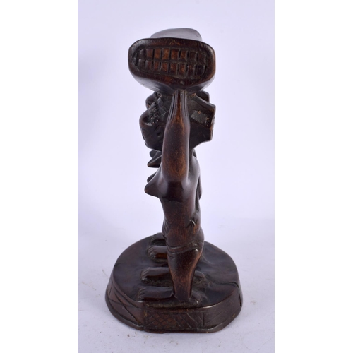 490 - AN AFRICAN TRIBAL CARVED WOOD HEAD REST. 18 cm x 12 cm.