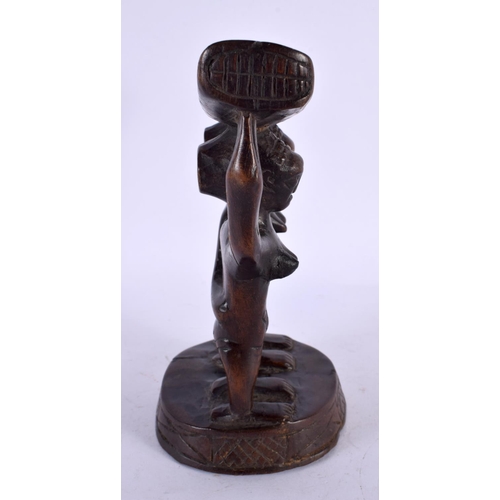 490 - AN AFRICAN TRIBAL CARVED WOOD HEAD REST. 18 cm x 12 cm.