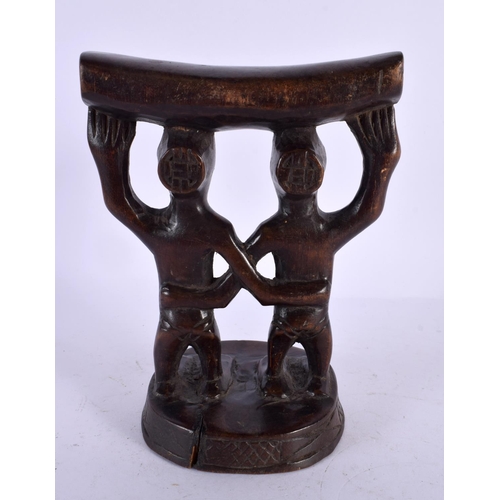 490 - AN AFRICAN TRIBAL CARVED WOOD HEAD REST. 18 cm x 12 cm.